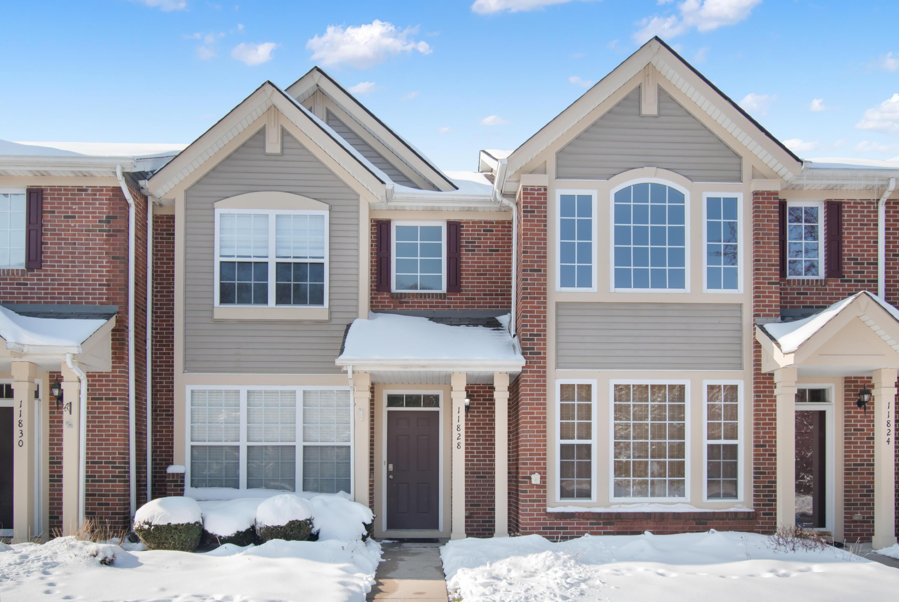 a front view of a house with a yard