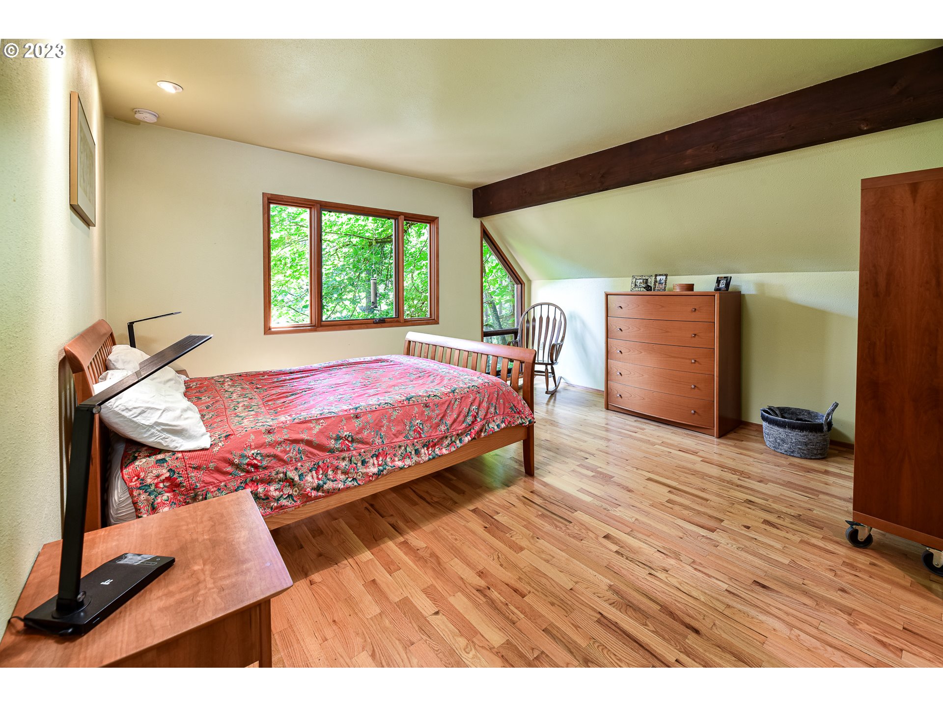 1878 Fircrest Drive Eugene, OR 97403 - Photo 20 of 38 a bedroom with a bed and wooden floor