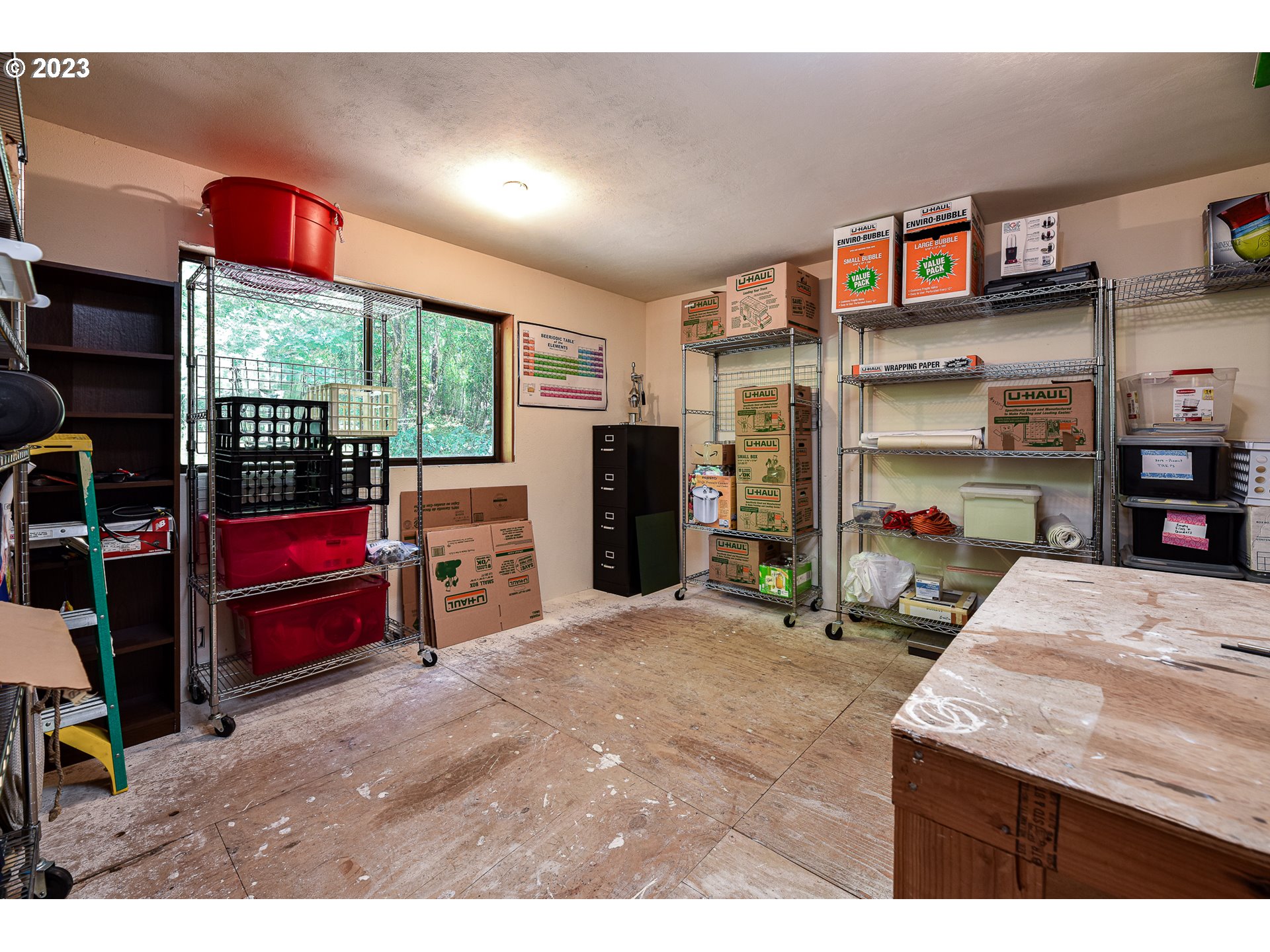 1878 Fircrest Drive Eugene, OR 97403 - Photo 31 of 38 a living room with furniture a flat screen tv and a refrigerator