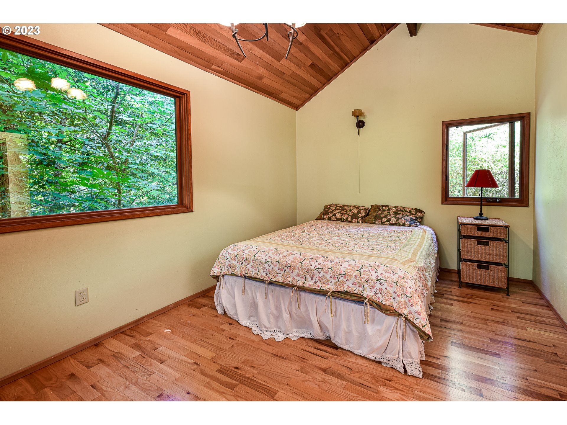 1878 Fircrest Drive Eugene, OR 97403 - Photo 35 of 38 a bedroom with a bed and a flat tv screen on dresser