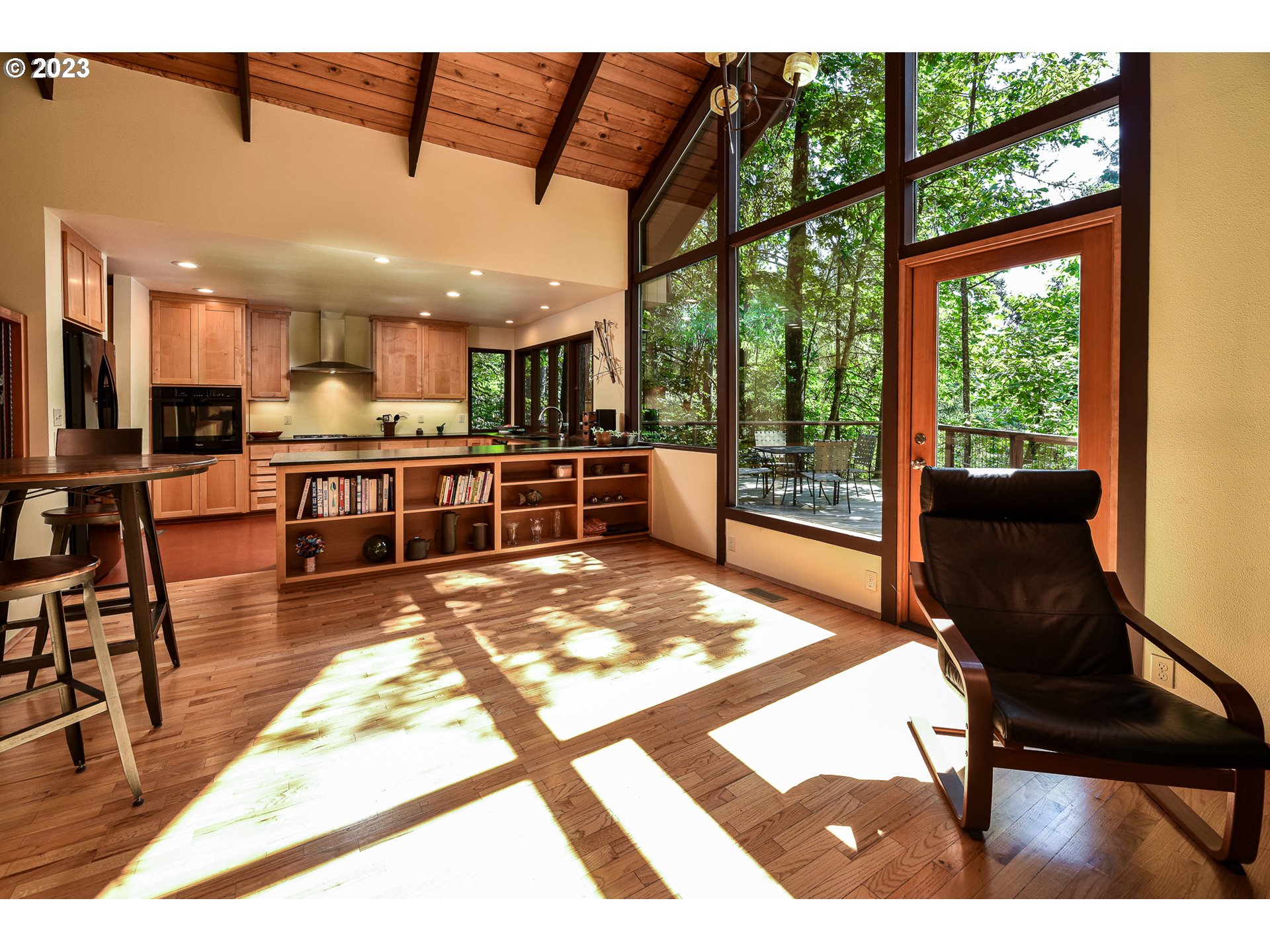 1878 Fircrest Drive Eugene, OR 97403 - Photo 6 of 38 a view of a dining room with furniture a chandelier and wooden floor