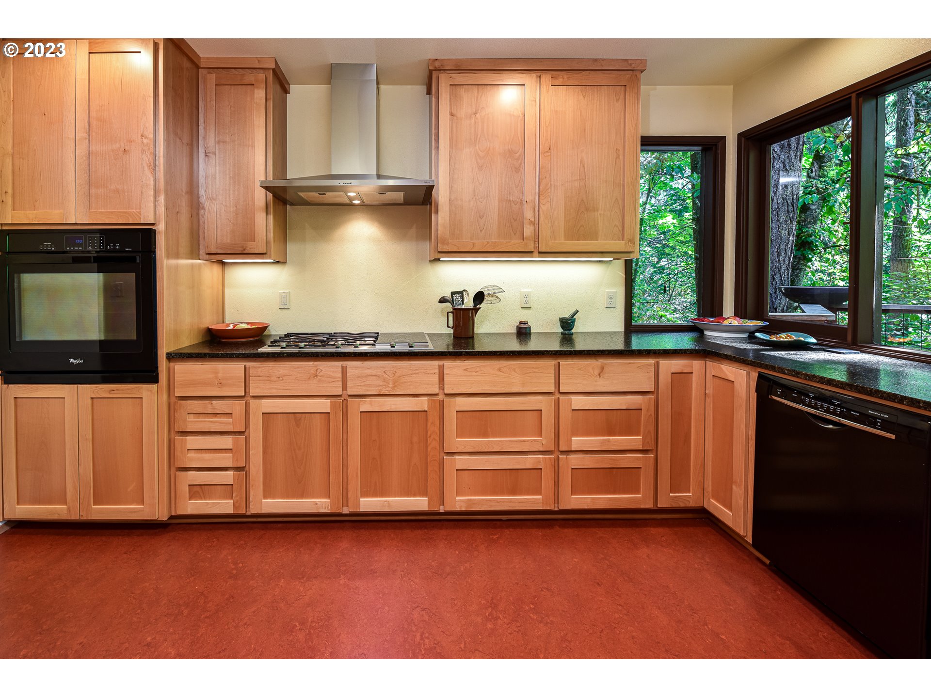 1878 Fircrest Drive Eugene, OR 97403 - Photo 10 of 38 a kitchen with granite countertop wooden cabinets and a sink
