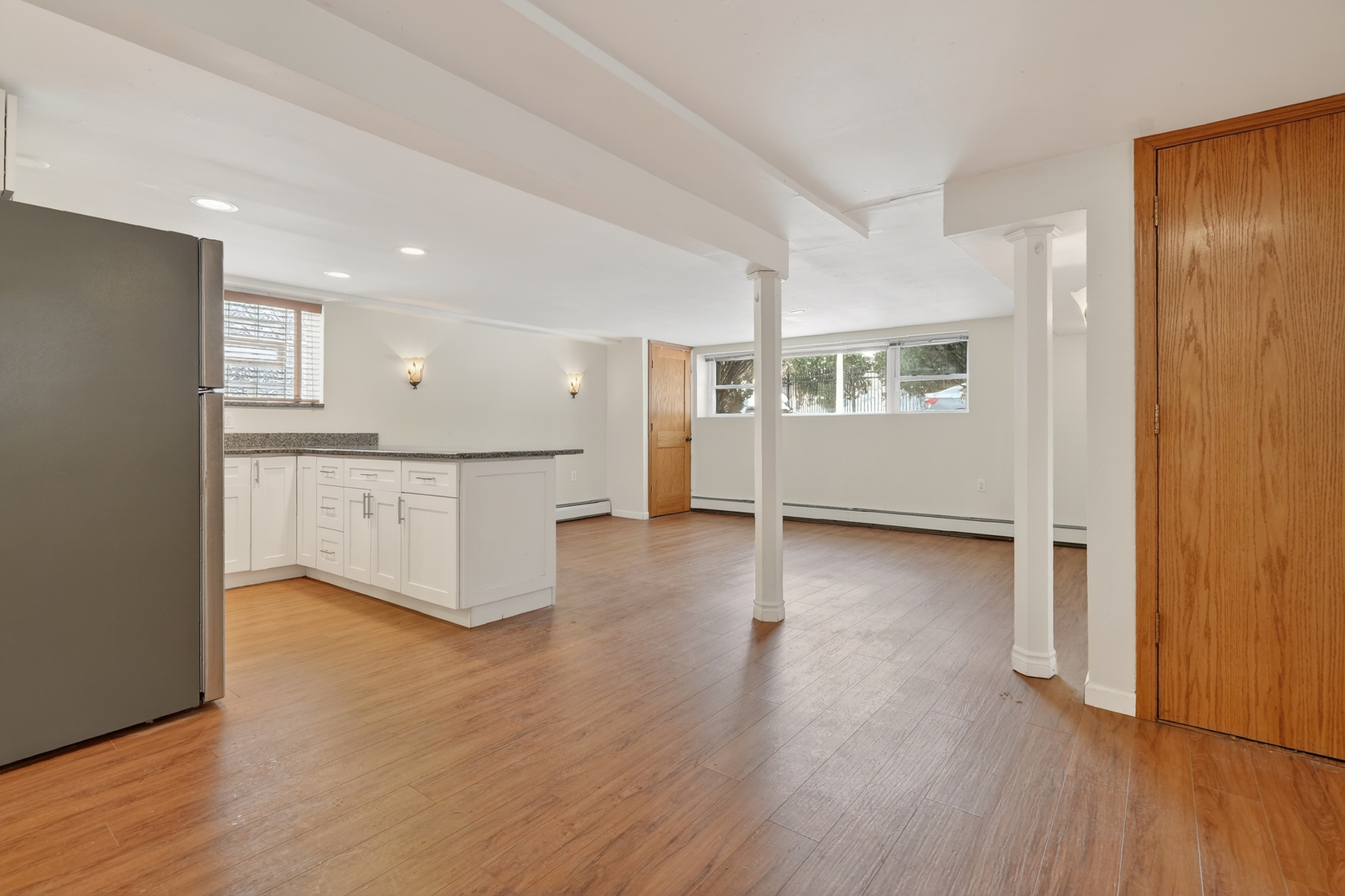 5101 North Kenton Avenue, Unit G Chicago, IL 60630 - Photo 2 of 25 a view of a kitchen with wooden floor and electronic appliances