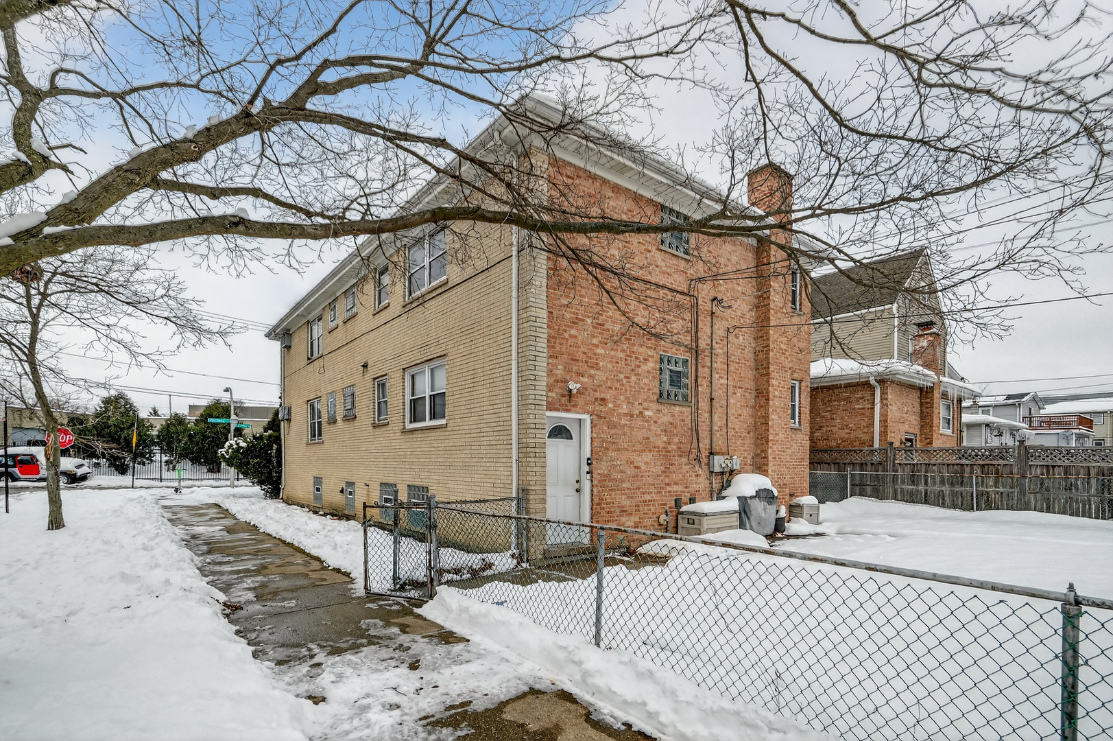 5101 North Kenton Avenue, Unit G Chicago, IL 60630 - Photo 25 of 25 a view of a house with a snow on the road