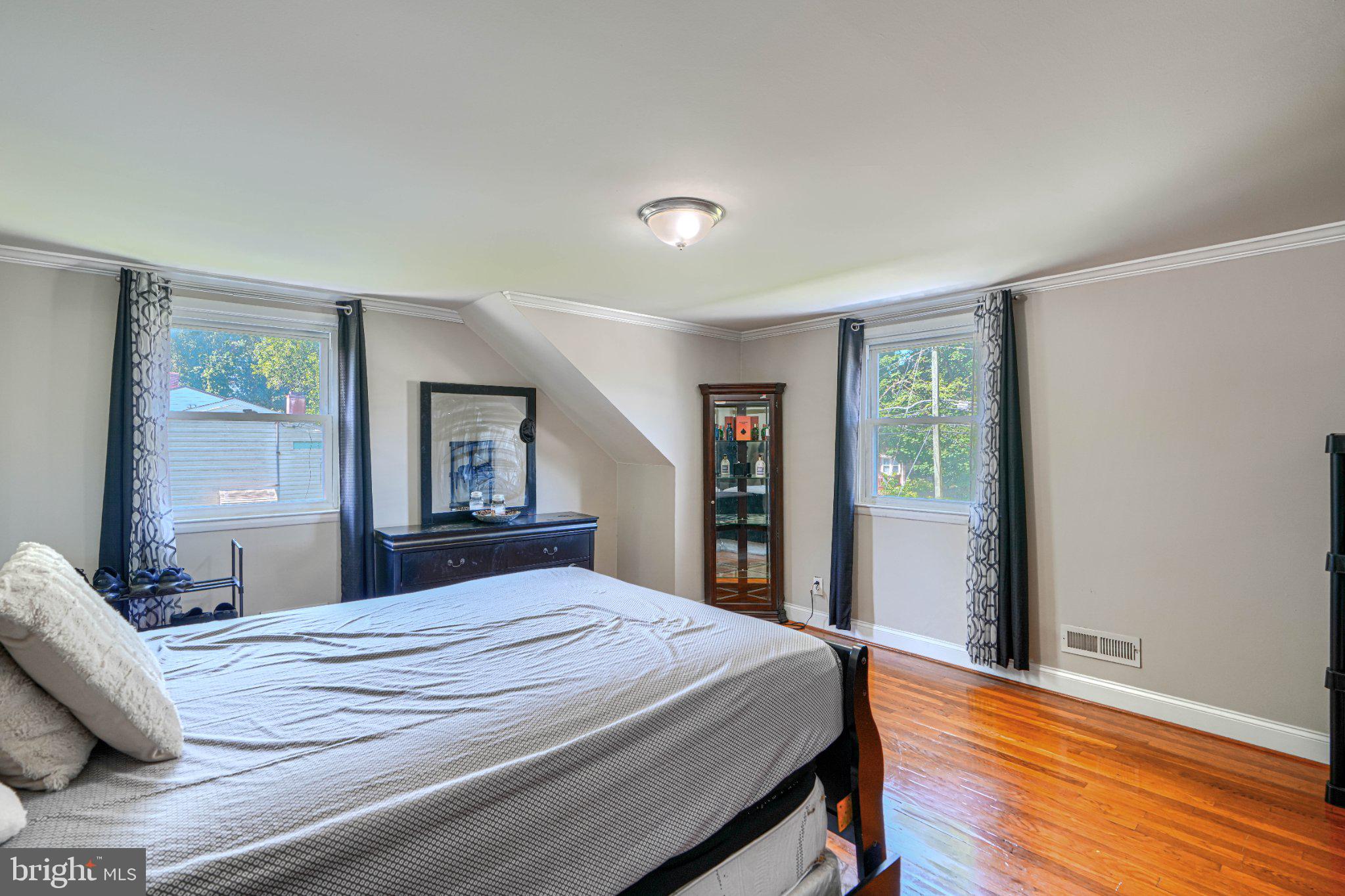 3708 Cassen Road Randallstown, MD 21133 - Photo 25 of 38 a bedroom with a large bed and a window