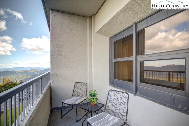 a view of a balcony with chair