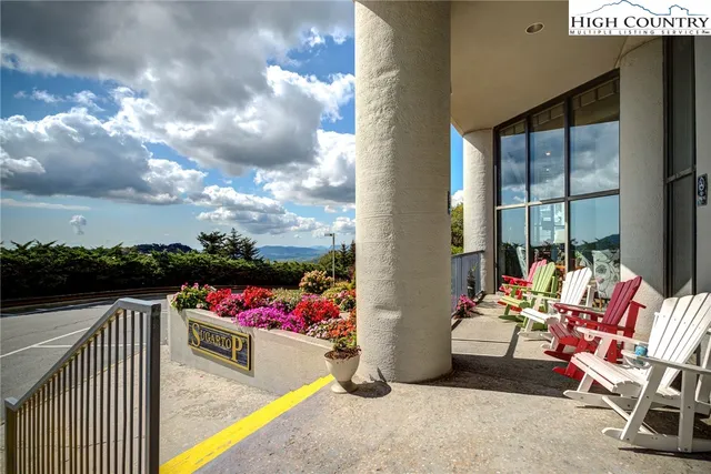 a view of a living room and chandelier