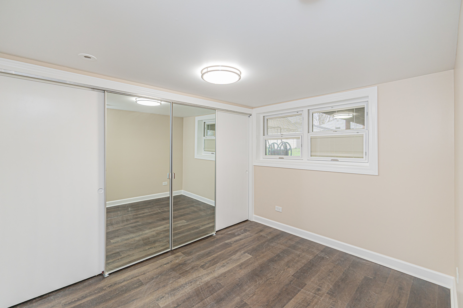 692 Maple Drive Buffalo Grove, IL 60089 - Photo 15 of 30 an empty room with wooden floor and windows