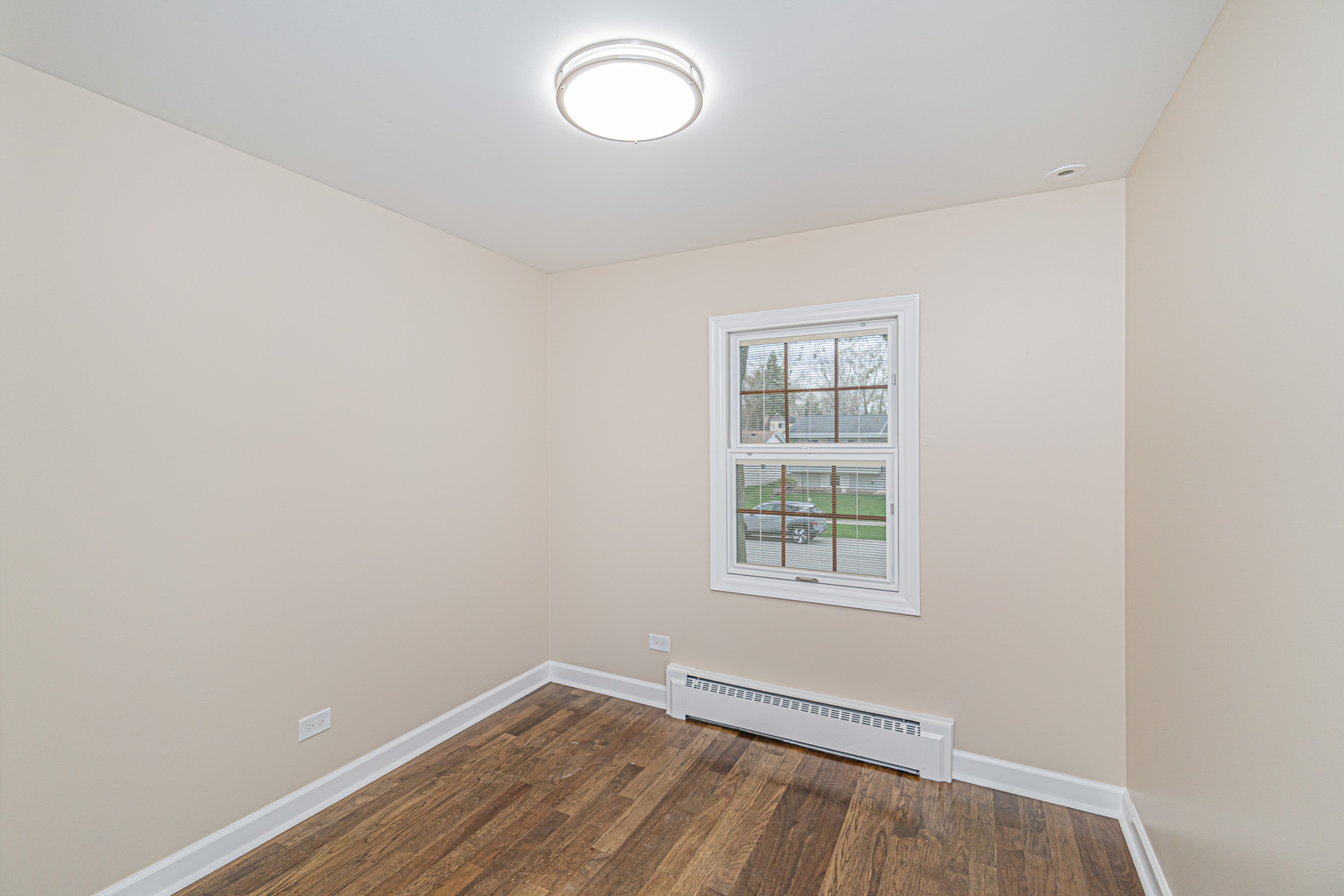 692 Maple Drive Buffalo Grove, IL 60089 - Photo 16 of 30 an empty room with wooden floor and windows