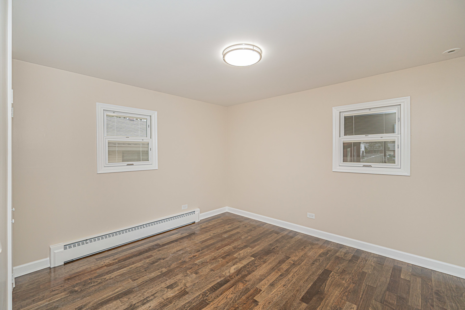 692 Maple Drive Buffalo Grove, IL 60089 - Photo 18 of 30 a view of empty room with wooden floor and fan