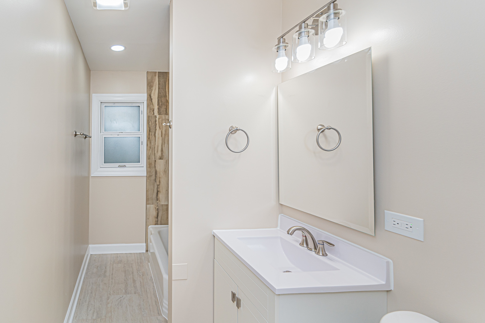 692 Maple Drive Buffalo Grove, IL 60089 - Photo 19 of 30 a bathroom with a sink a mirror and shower