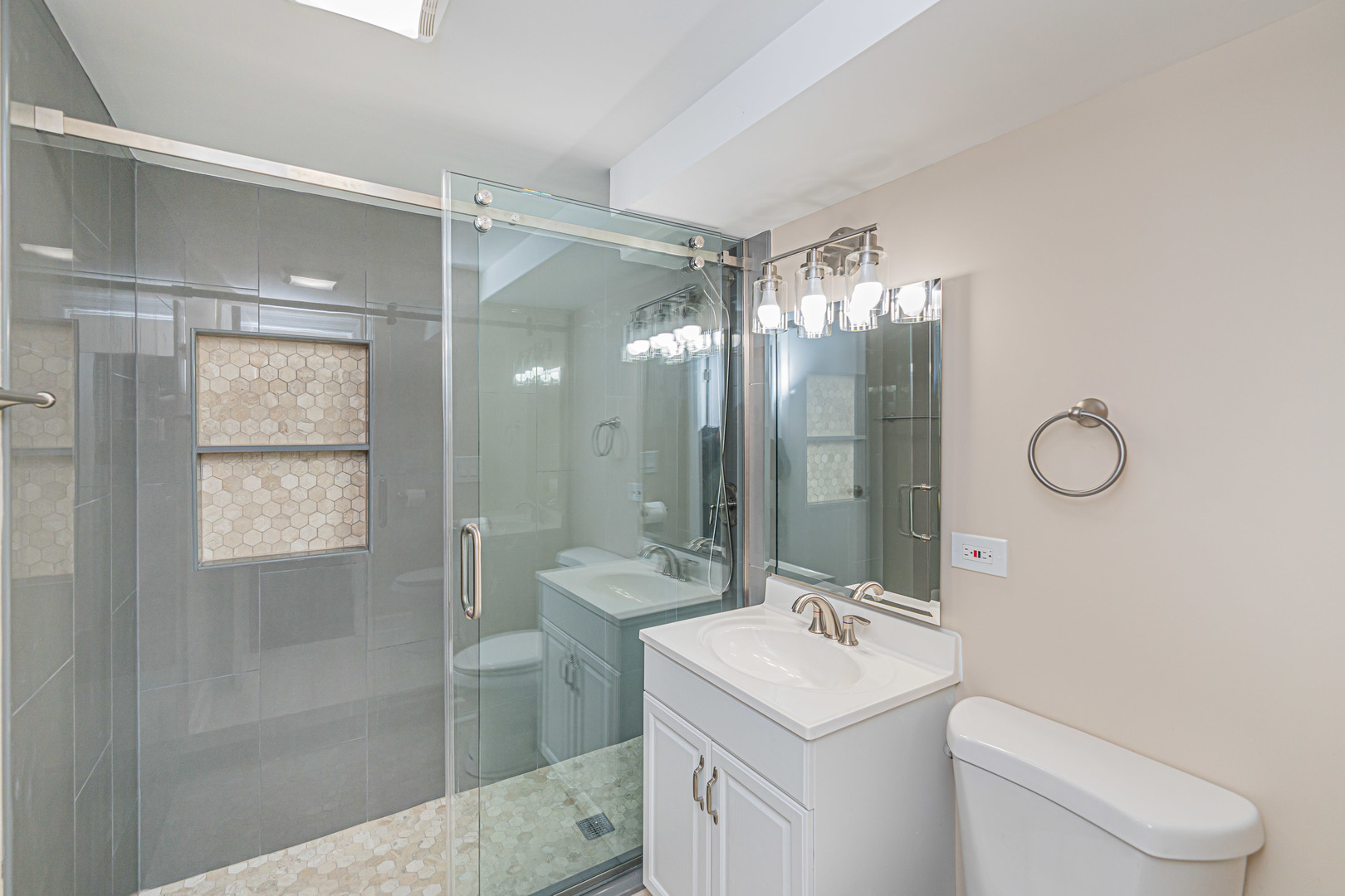 692 Maple Drive Buffalo Grove, IL 60089 - Photo 23 of 30 a bathroom with a sink toilet and shower