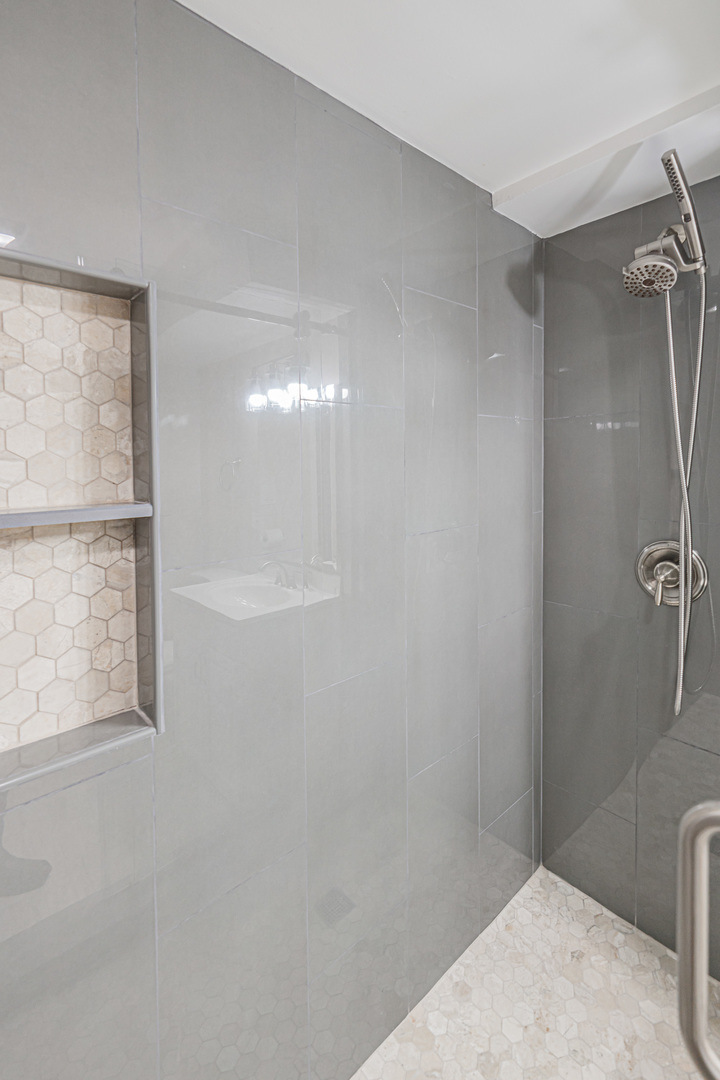 692 Maple Drive Buffalo Grove, IL 60089 - Photo 24 of 30 a bathroom with a shower