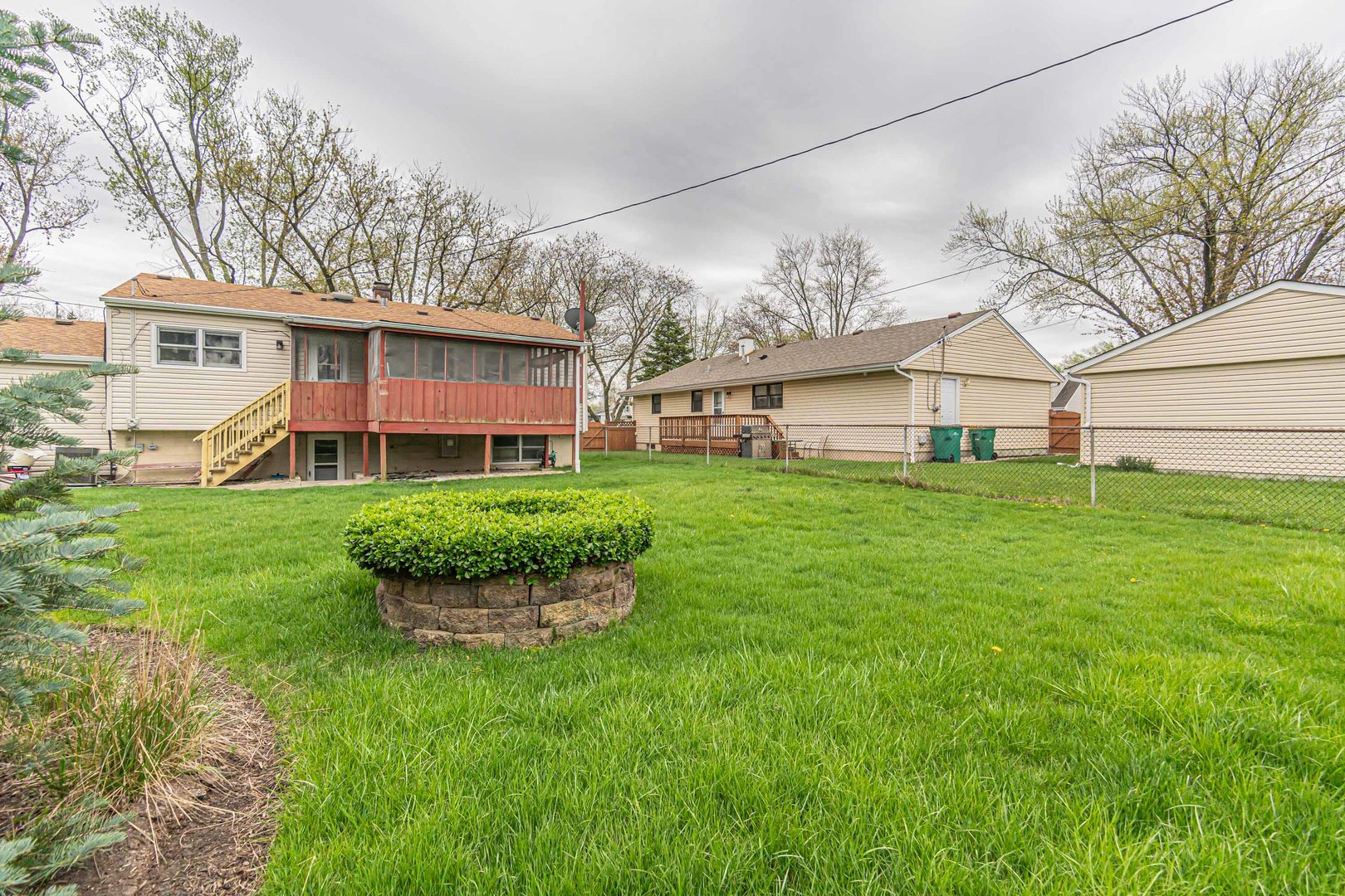 692 Maple Drive Buffalo Grove, IL 60089 - Photo 27 of 30 a view of a house with a big yard and large trees