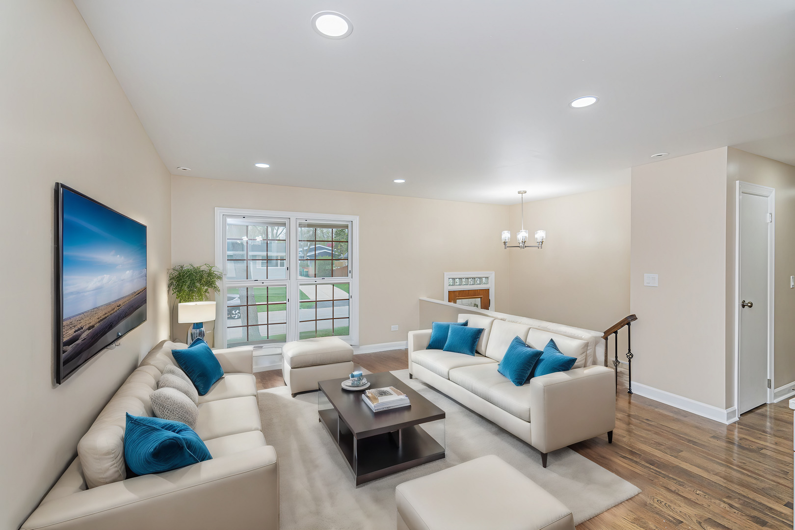 692 Maple Drive Buffalo Grove, IL 60089 - Photo 3 of 30 a living room with furniture and a flat screen tv