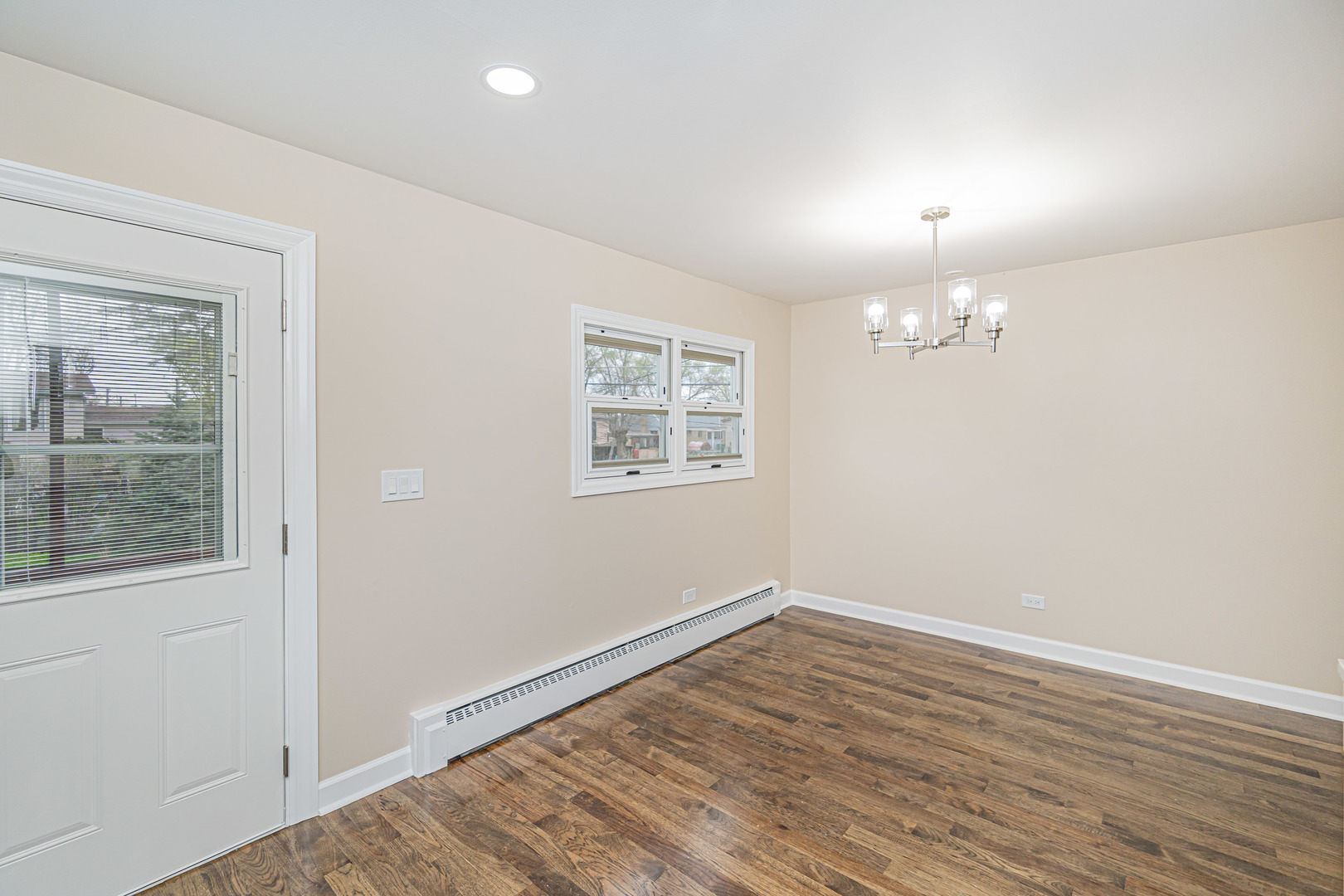 692 Maple Drive Buffalo Grove, IL 60089 - Photo 10 of 30 wooden floor in an empty room with a window