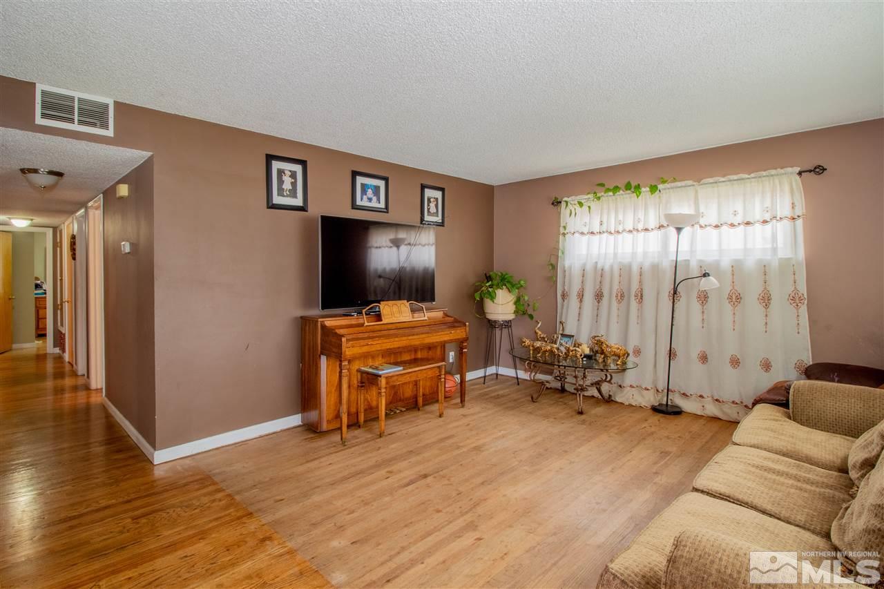 1611 Clemson Road Reno, NV 89502 - Photo 2 of 16 a living room with furniture and a flat screen tv