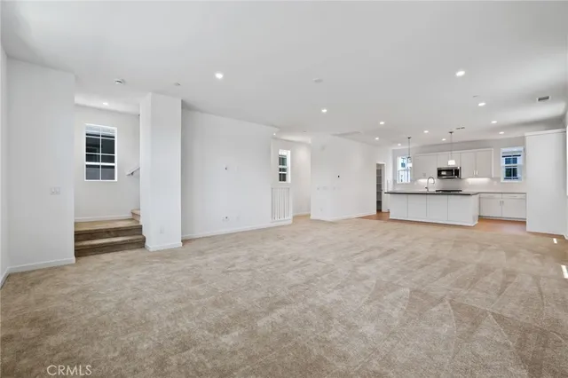 a big room with closet and windows