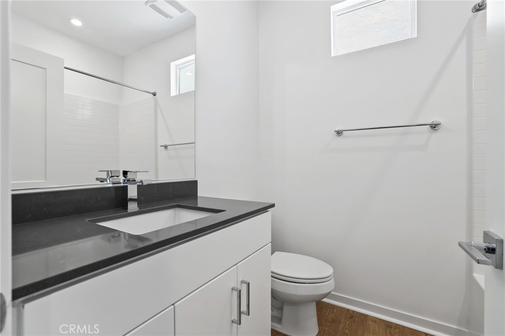 139 Jessup Way Tustin, CA 92780 - Photo 15 of 31 a bathroom with a sink toilet and vanity