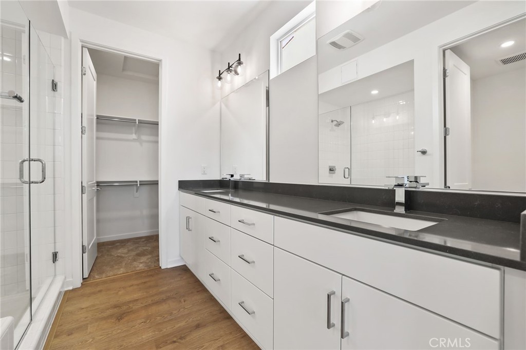 139 Jessup Way Tustin, CA 92780 - Photo 19 of 31 a bathroom with a granite countertop double vanity sink and mirror