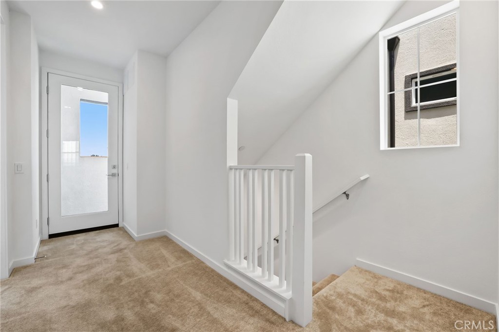139 Jessup Way Tustin, CA 92780 - Photo 20 of 31 a view of a hallway to rooms and stairs
