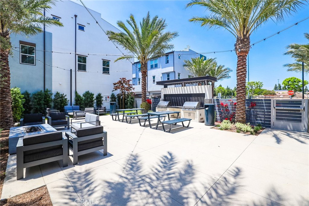 139 Jessup Way Tustin, CA 92780 - Photo 2 of 31 a view of a swimming pool with a lounge chairs