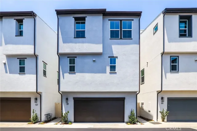 a kitchen with kitchen island stainless steel appliances a sink and refrigerator
