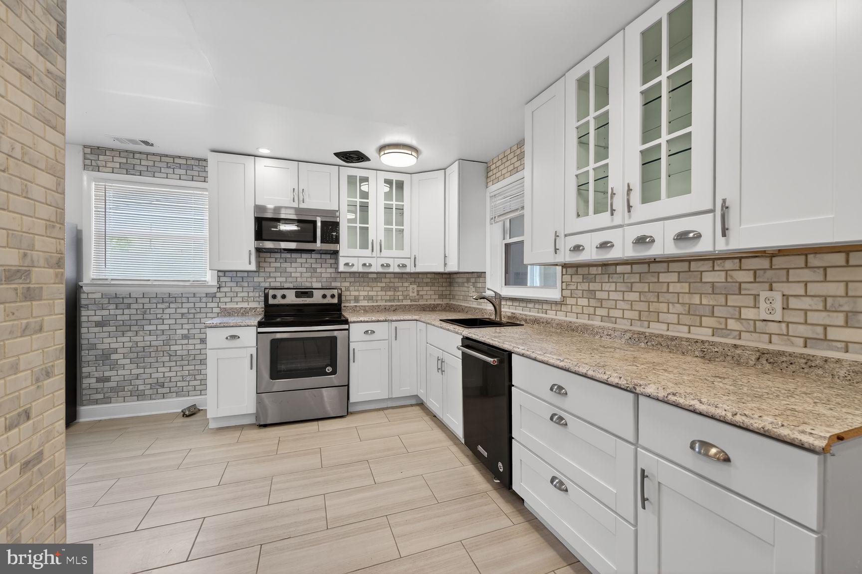 7205 Livingston Road Oxon Hill, MD 20745 - Photo 8 of 25 Modern kitchen with sleek finishes.