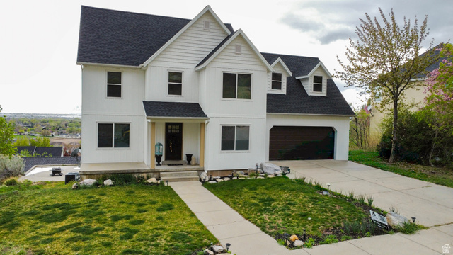 965 North 800 East Springville, UT 84663 - Photo 3 of 46 View of front of home with a shingled roof, concrete driveway, and a front yard