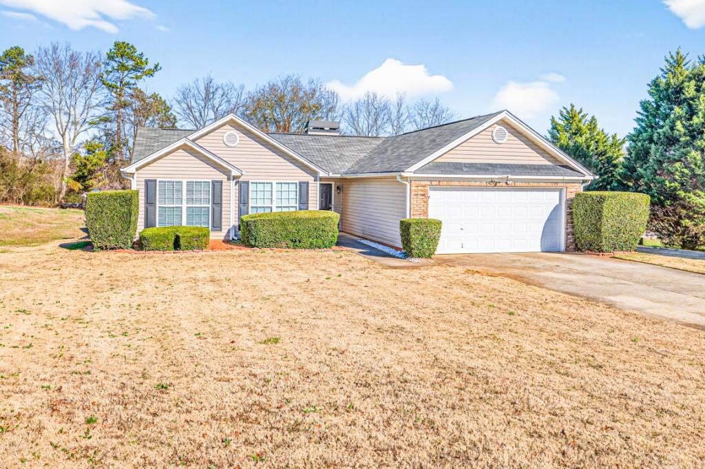 1501 Cardinal Lane Winder, GA 30680 - Photo 1 of 33 a front view of a house with a yard and garage