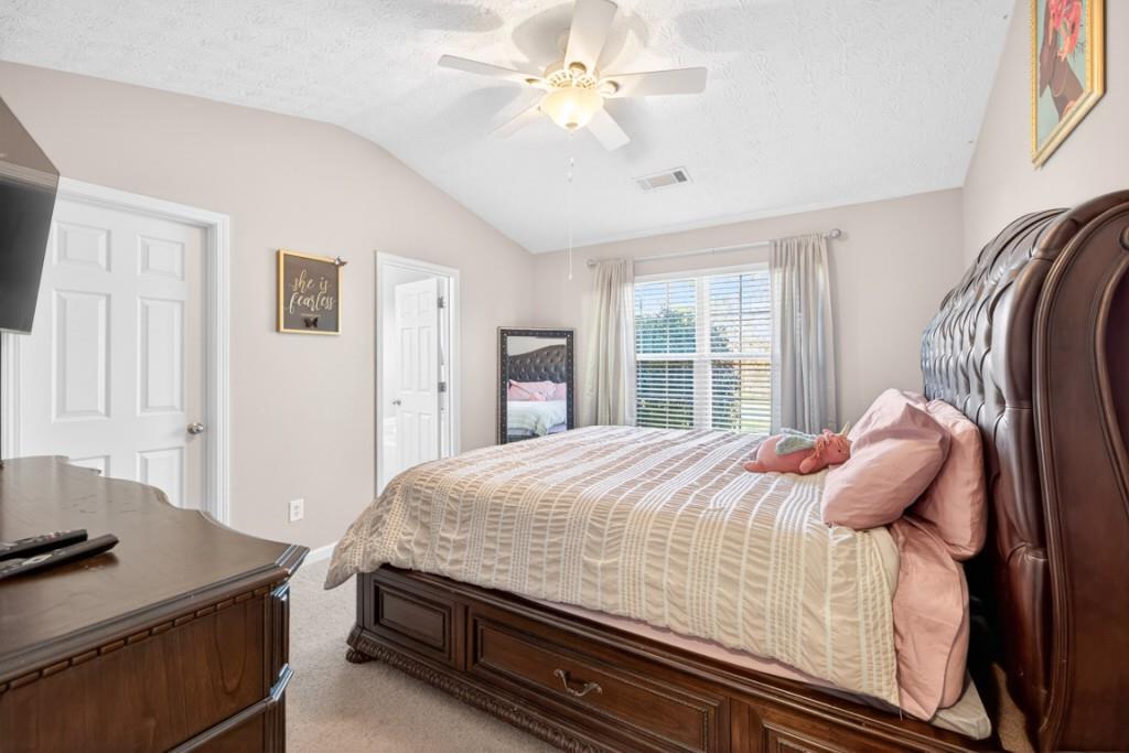 1501 Cardinal Lane Winder, GA 30680 - Photo 16 of 33 a bedroom with a bed and a window