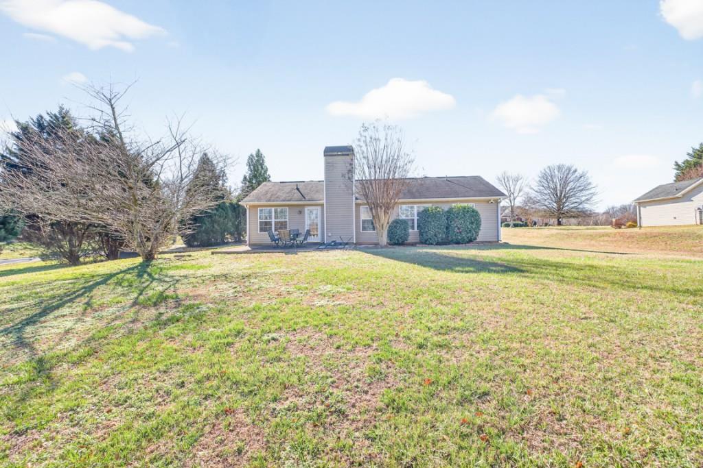 1501 Cardinal Lane Winder, GA 30680 - Photo 29 of 33 a view of a house with a big yard and a large tree