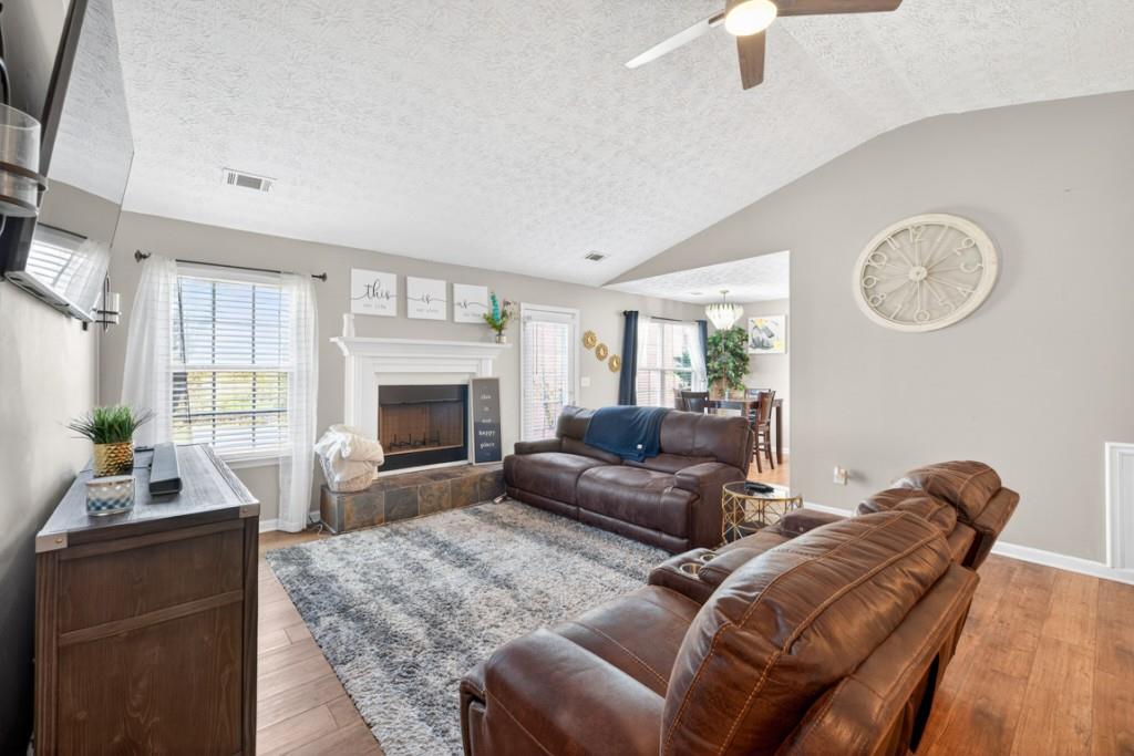 1501 Cardinal Lane Winder, GA 30680 - Photo 4 of 33 a living room with furniture and a fireplace