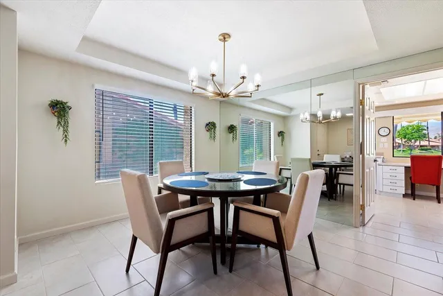 a view of a dining room with furniture and window