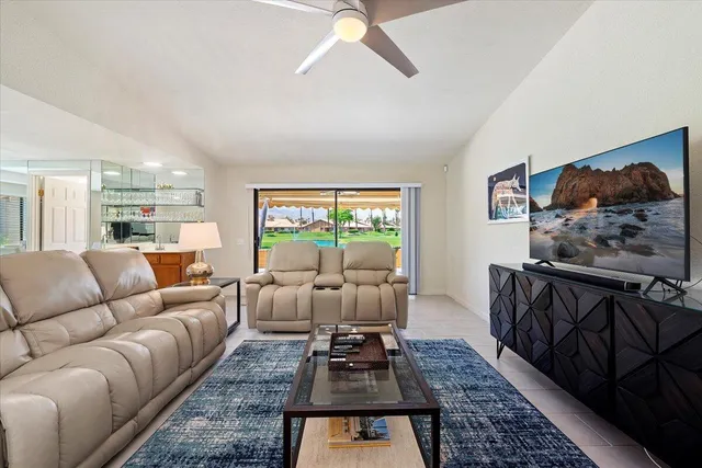 a living room with furniture and a rug