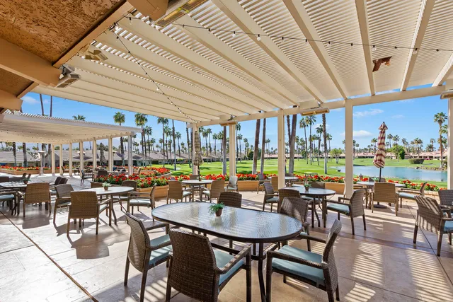 a outdoor space with lots of table and chairs