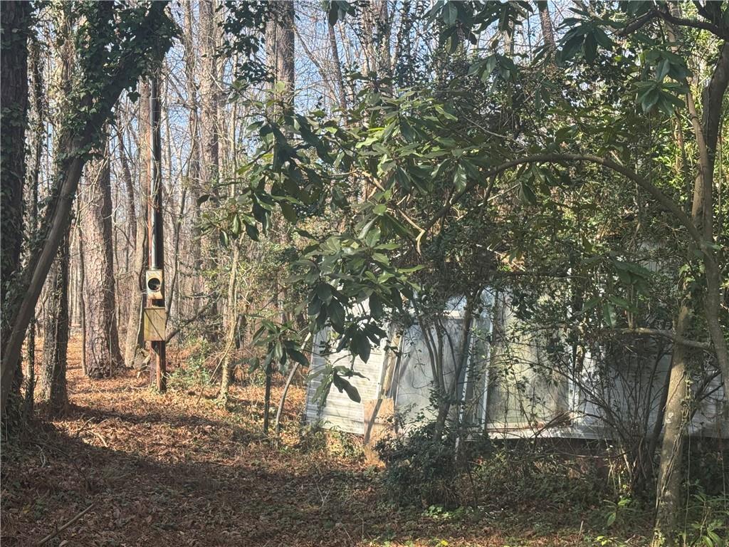 2973 Lee Road Southwest Snellville, GA 30039 - Photo 20 of 24 a backyard of a house with lots of green space