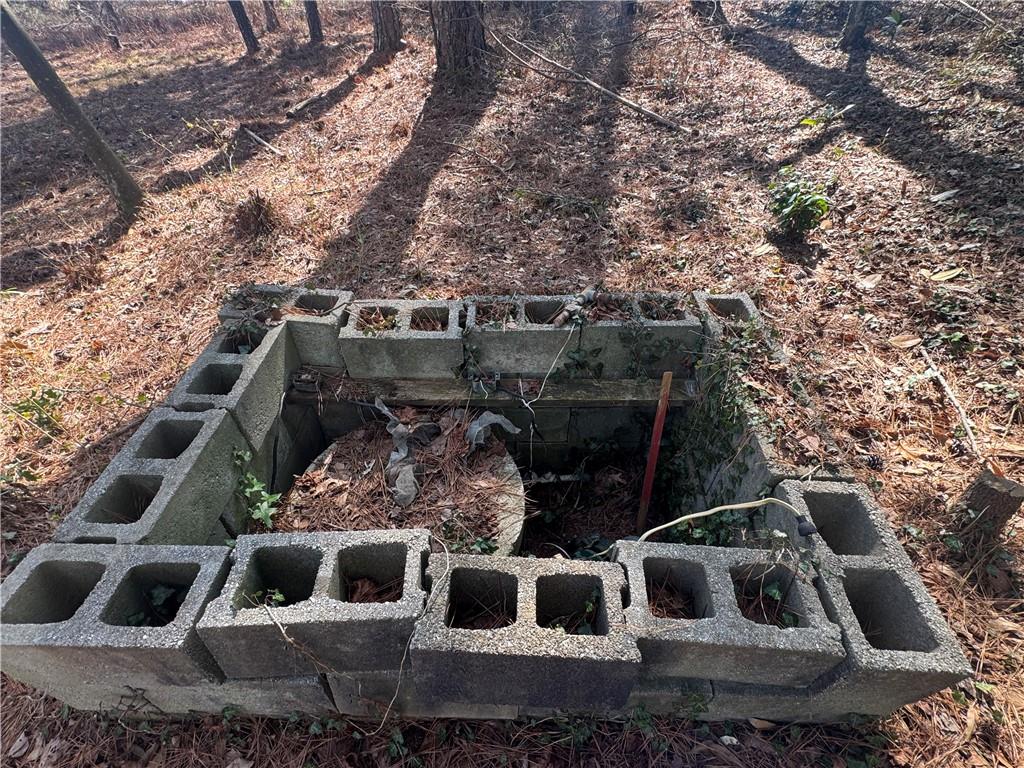 2973 Lee Road Southwest Snellville, GA 30039 - Photo 21 of 24 a house with trees in front of it