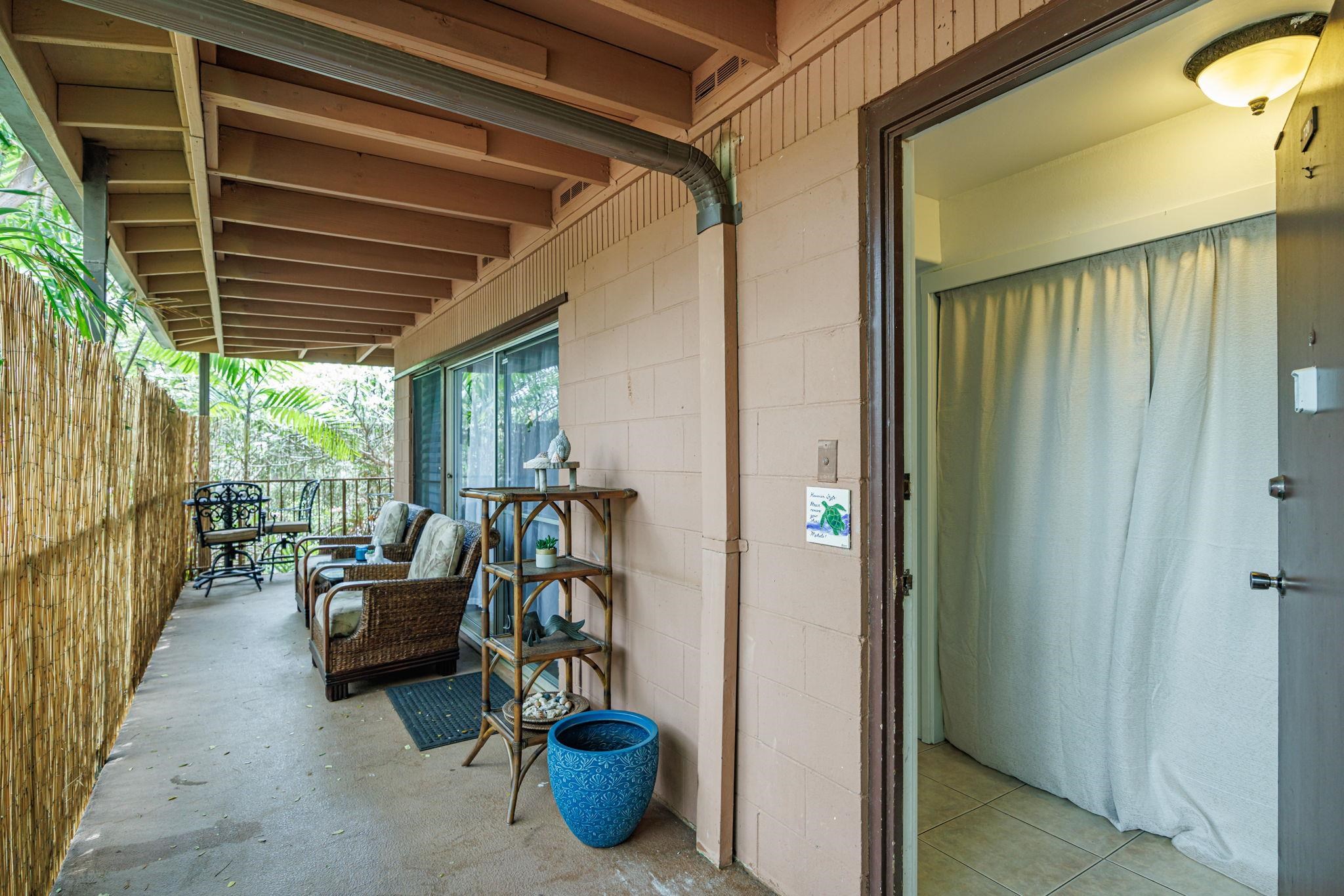 3559 Lower Honoapiilani Road, Unit 720 Lahaina, HI 96761 - Photo 4 of 31 a view of a patio with chairs and potted plants