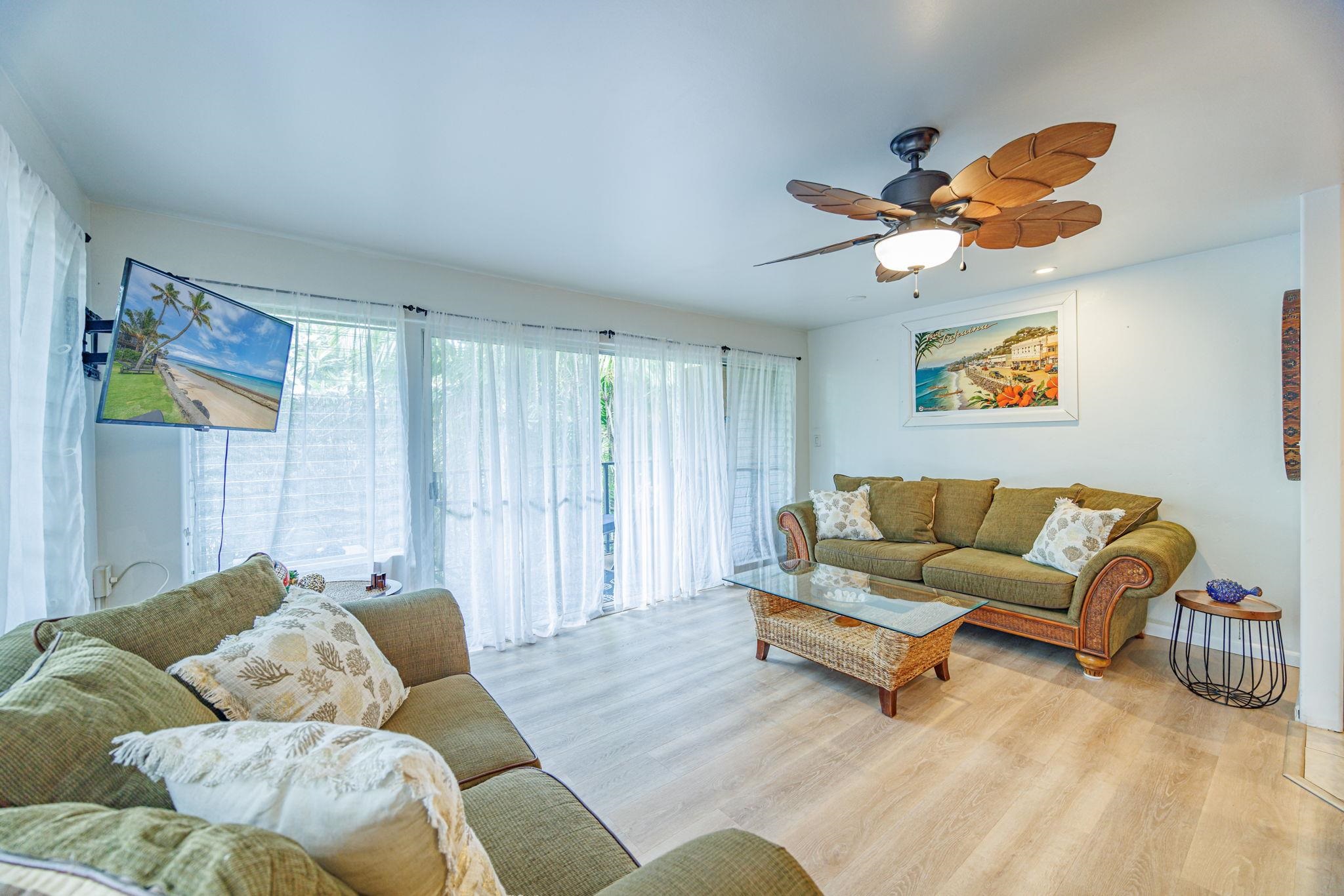3559 Lower Honoapiilani Road, Unit 720 Lahaina, HI 96761 - Photo 10 of 31 a living room with furniture and a wooden floor
