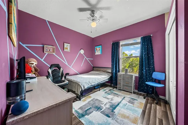 a bedroom with furniture and a chandelier