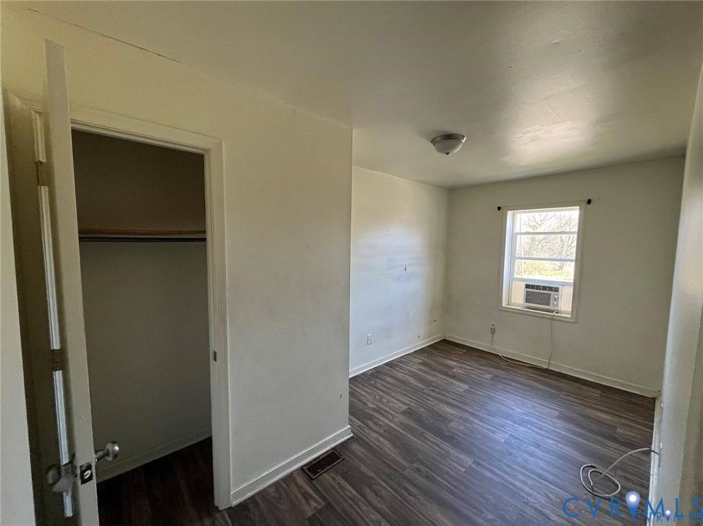 707-709 Harding Street Petersburg, VA 23803 - Photo 8 of 14 an empty room with wooden floor and windows