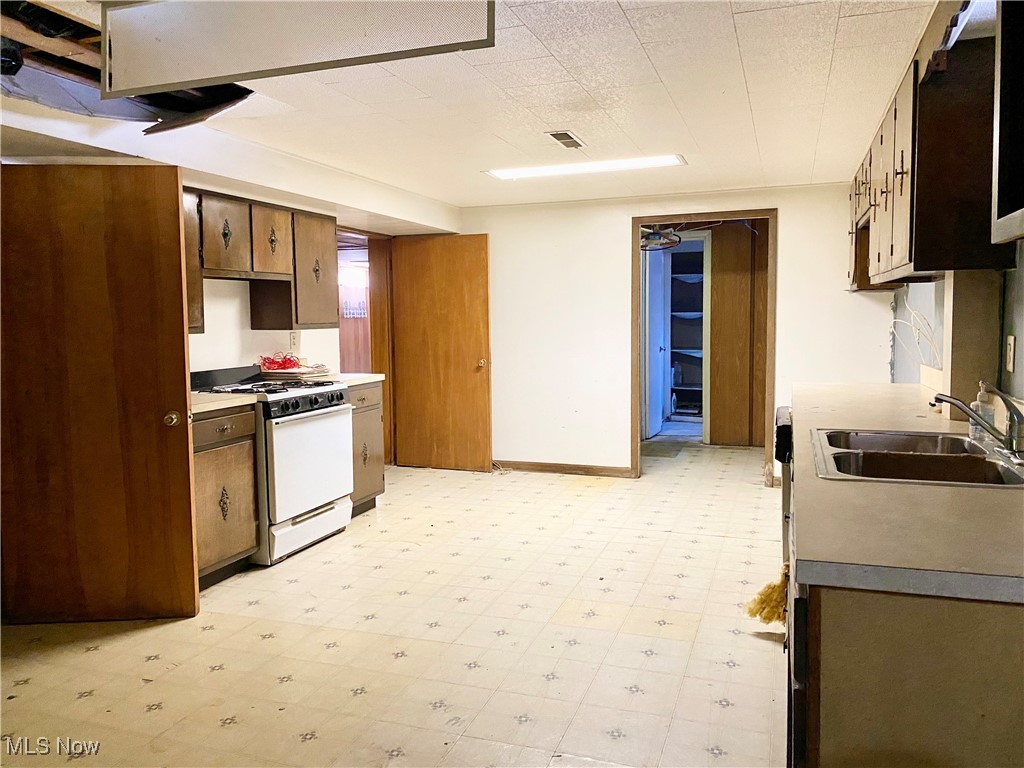 1034 Straub Road West Mansfield, OH 44904 - Photo 18 of 27 Kitchen with sink and white gas range