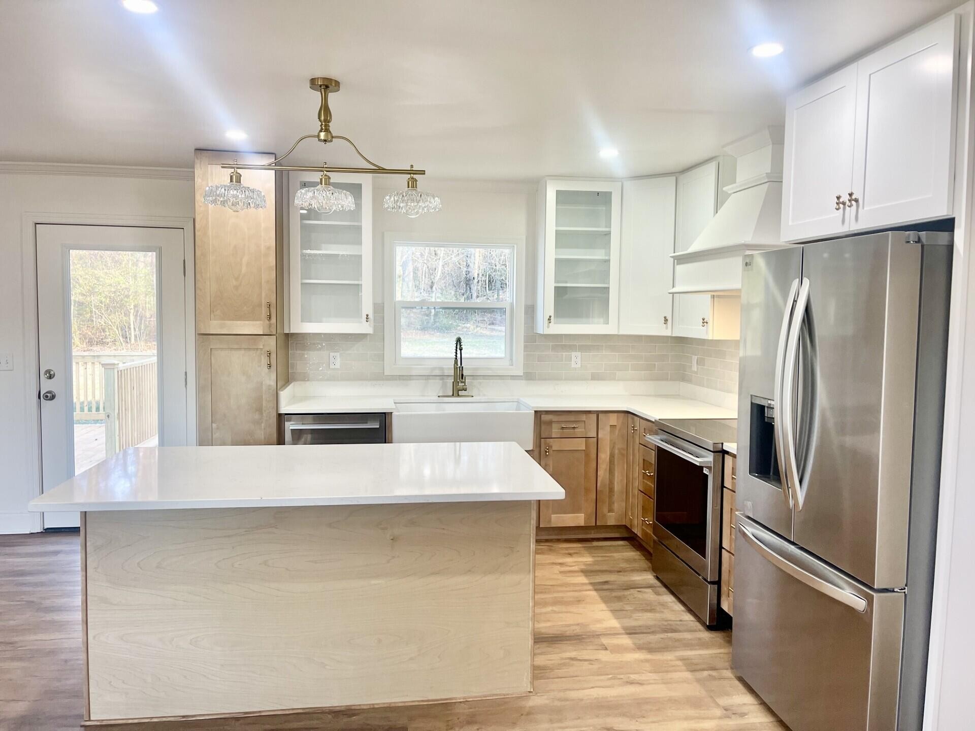 721 South Jackson Street Athens, TN 37303 - Photo 6 of 17 a large kitchen with cabinets and stainless steel appliances