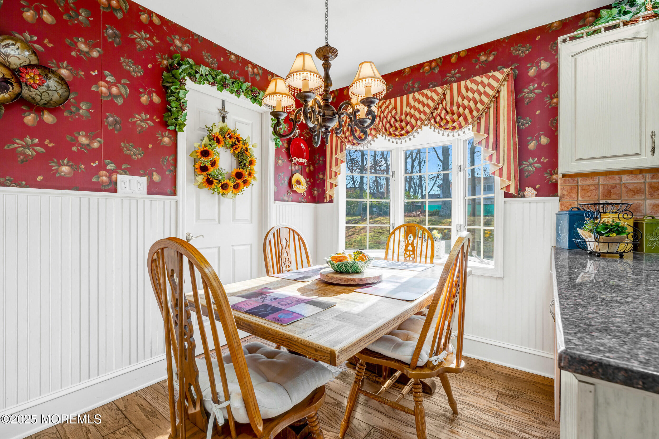 21 Meadowbrook Drive Howell, NJ 07731 - Photo 20 of 52 a view of a dining room with furniture a chandelier and wooden floor