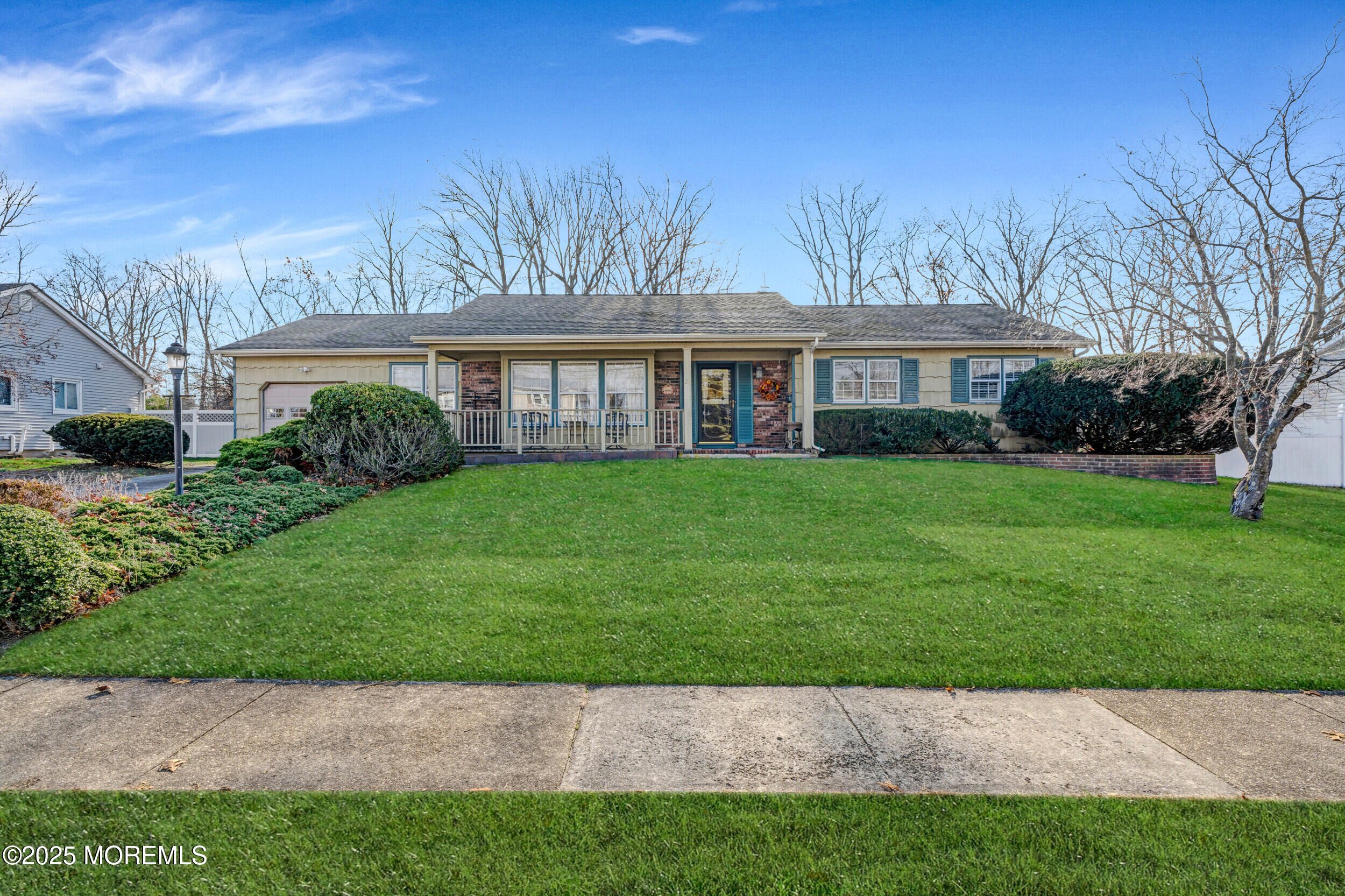 21 Meadowbrook Drive Howell, NJ 07731 - Photo 2 of 52 a front view of a house with a garden and trees