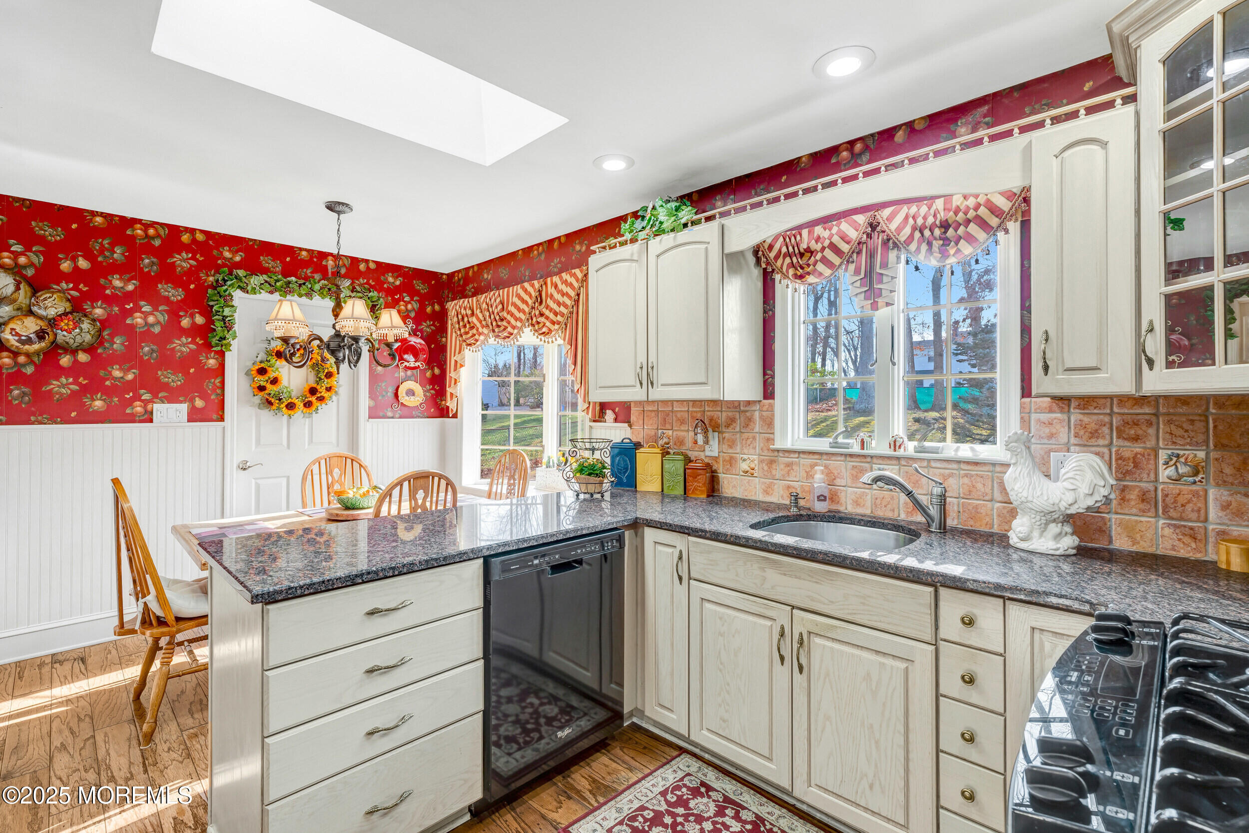 21 Meadowbrook Drive Howell, NJ 07731 - Photo 24 of 52 a kitchen with stainless steel appliances a sink window and cabinets