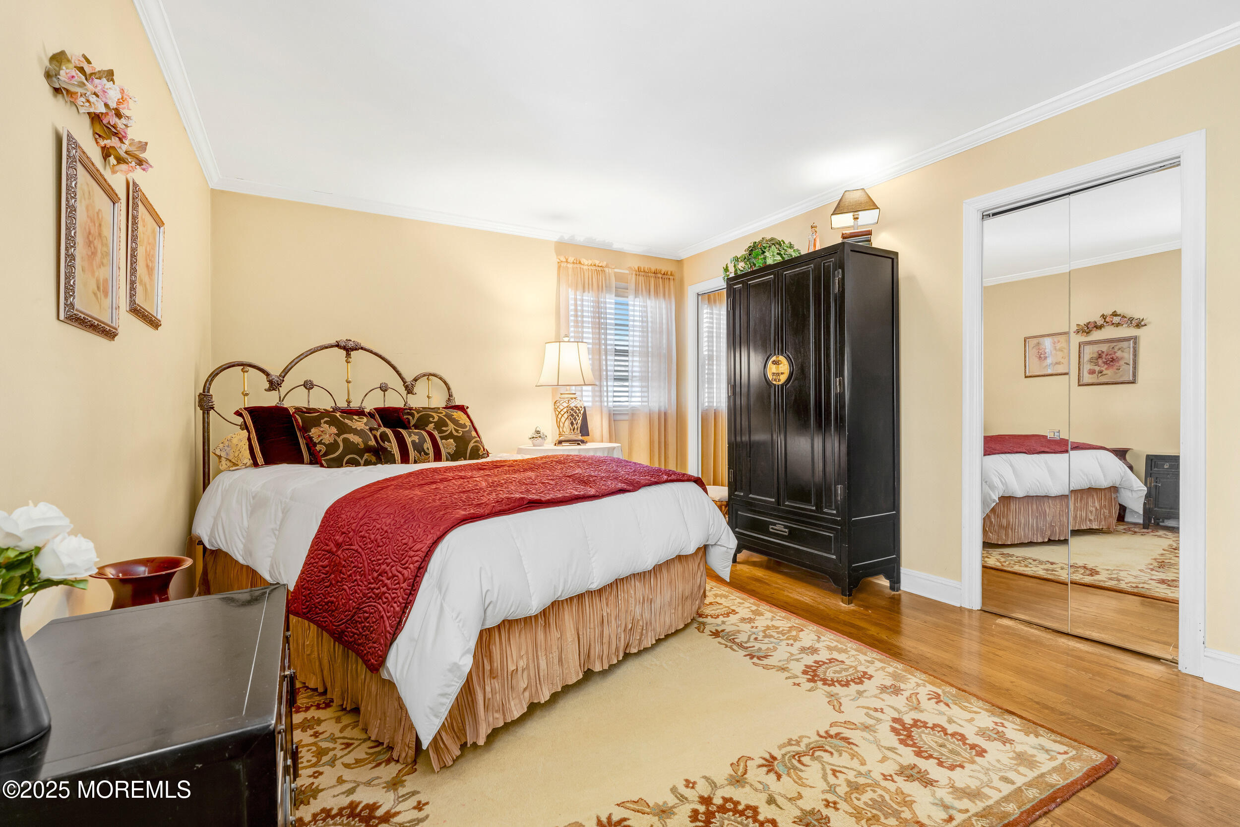 21 Meadowbrook Drive Howell, NJ 07731 - Photo 36 of 52 a bedroom with a bed and wooden floor