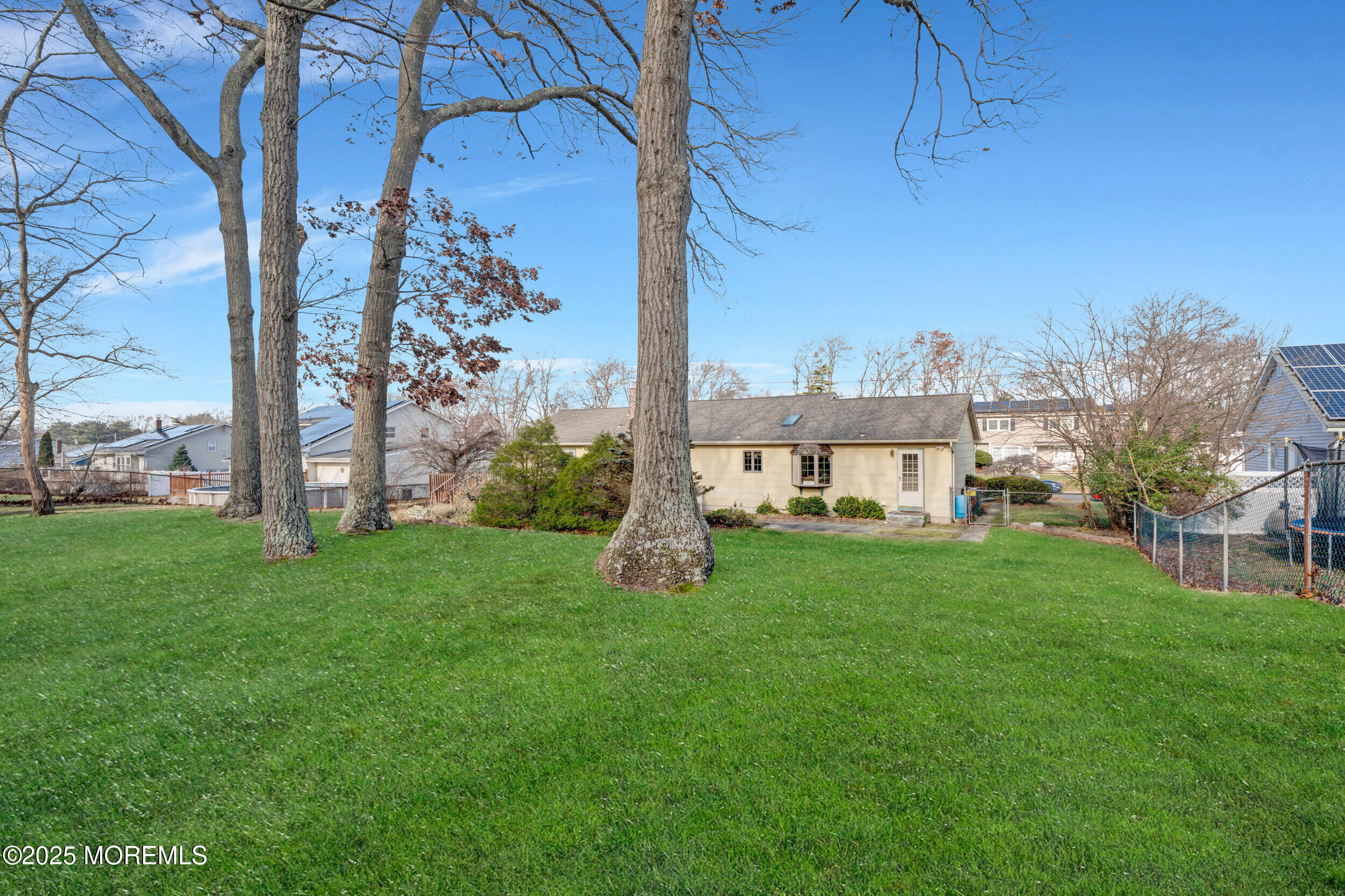 21 Meadowbrook Drive Howell, NJ 07731 - Photo 49 of 52 a view of a big house with a big yard and large tree