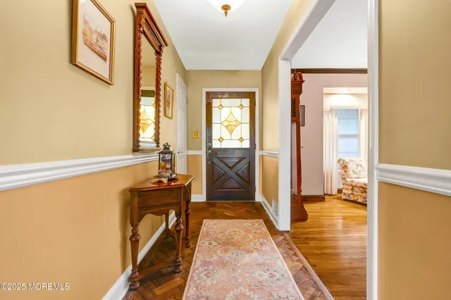 a view of a living room with furniture and a fireplace